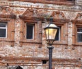 Street lamp against the background of the facade of the old monastery building, red brick laying, Moscow, 2021 Royalty Free Stock Photo