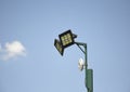 street lamp with CCTV cameras on a metal pole against blue sky Royalty Free Stock Photo