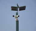 street lamp with CCTV cameras on a metal pole against blue sky Royalty Free Stock Photo
