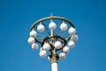 Street lamp Circles Round white lampshades. Landscaping