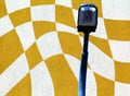 Street lamp close up with textured stucco abstract background in Vasarely style