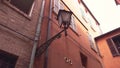 Street lamp detail in Via delle Volte in Ferrara in Italy