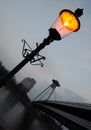 Street lamp at dusk near river