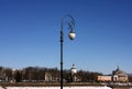 Street lamp on the embankment of the river across from the river station.