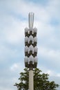 Street lamp in the form of ears with white lampshades. Landscaping