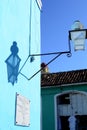Street lamp and its shadow on the wall. Trinidad, Cuba Royalty Free Stock Photo