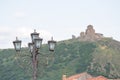 Street lamp with Jvari monastery at the background