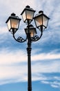 Street lamp lit at dusk Royalty Free Stock Photo