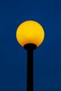Street lamp lit with yellow light