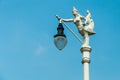Street Lamp, Mythical female bird with a human head, Kinnaree and blue sky