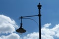 Street lamp pole and light fixture under blue sky Royalty Free Stock Photo