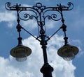 Street lamp pole and light fixtures under blue sky Royalty Free Stock Photo