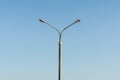 Street lamp post on blue sky background