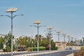 Street lamp powered with a solar panel battery against blue sky.  Alternative energy and save ecology concept Royalty Free Stock Photo