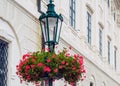 Street lamp with red flowers Royalty Free Stock Photo