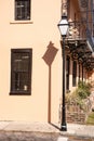 Street lamp, shadow, and balcony in the French Quarter, Charleston, SC