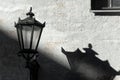 Street lamp with shadow on wall Royalty Free Stock Photo