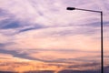 Street lamp silhouette on colorful dawn/dusk sky background. Royalty Free Stock Photo