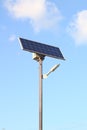 street lamp with a solar battery against a blue sky Royalty Free Stock Photo