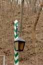 Street lamp on a striped pole.