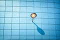 Street lamp throws shadow over blue wall. Concept minimalism Royalty Free Stock Photo