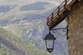 A street lamp under the roof of a traditional mountain house Royalty Free Stock Photo