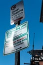 Street lamppost and signage seen in a parking area in downtown Boston.