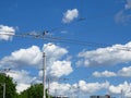 Street lamps and trolleybus electricity power grid supply. City town urban landscape.