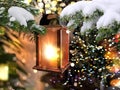 Street Lantern blurred  night light  Christmas tree branch Snowy   festive city marketplace fluffy snowflakes festive decoration Royalty Free Stock Photo