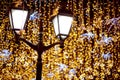 Street lantern with decorative Christmas garlands. New year and Christmas celebration