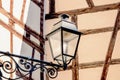 Street lantern on the half timbered wall background Royalty Free Stock Photo