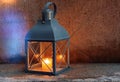 Street lantern on medieval  stone wall   with yellow light candle Royalty Free Stock Photo