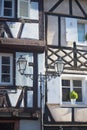 Street lantern, sky and and a wall. Fahverk. Details. Free space. Colmar, France Royalty Free Stock Photo