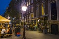 Street lanterns on the sidewalks in Amsterdam - evening view - AMSTERDAM - THE NETHERLANDS - JULY 20, 2017