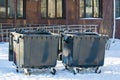 Street large black plastic garbage containers, theme ecology, environmental cleanliness, streets Royalty Free Stock Photo