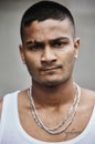 Street life. Cropped portrait of a handsome young male gangster standing outside on the street. Royalty Free Stock Photo