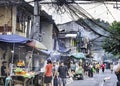 Street life,smoke and overhanging wires,in the old walled city of Intramuros