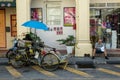 Street life of Trishaw driver and people read newspaper at street.