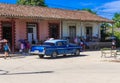 Street life view with a blue american classic car in Santa Clara