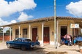 Street life view with cuban peoples and american blue Chrysler classic car in Santa Clara Cuba - Serie Cuba Reportage