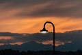 street light at dusk against a cloudy sunset Royalty Free Stock Photo