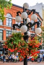 Street light with flower basket in Gastown district of Vancouver in British Columbia Canada Royalty Free Stock Photo