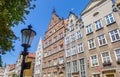 Street light and historic facades in Swietego Ducha street in Gdansk Royalty Free Stock Photo