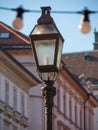 Street light lantern lamp. Old vintage antique retro urban exterior. Lamppost city illumination. Classic streetlight lighting. Royalty Free Stock Photo