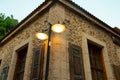 A street light and an old Ottoman time stone house on the streets of Antalya Old Town Kaleici Royalty Free Stock Photo