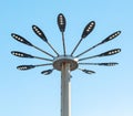 Street light pole with spotlights on blue sky background. Street lamp Royalty Free Stock Photo