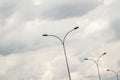 Street Light Poles Against Cloudy Blue Sky Royalty Free Stock Photo