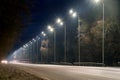 Street lighting, supports for ceilings with led lamps. concept of modernization and maintenance of lamps, place for text, night. Royalty Free Stock Photo