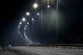 Street lighting, supports for ceilings with led lamps. concept of modernization and maintenance of lamps, place for text, night. Royalty Free Stock Photo