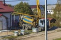 Street lighting. the truck is pouring concrete. a private house is being built